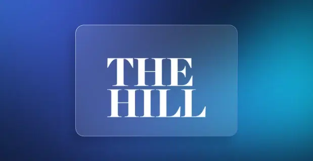 White text reading “THE HILL” centered on a translucent rounded rectangle over a gradient blue background.